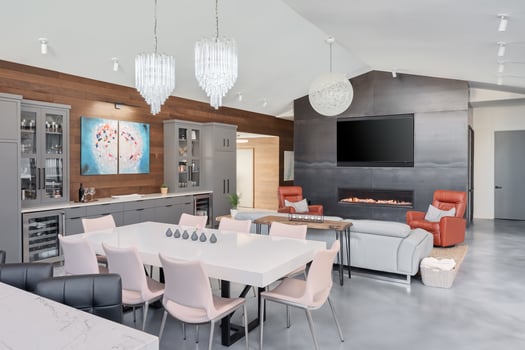 Redesigned dining room and living room areas with gray cabinets