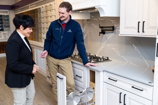 Cabinet IQ representative showcasing a cabinet model to a client